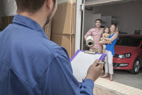 Man with van loading furniture in Tokyngton street