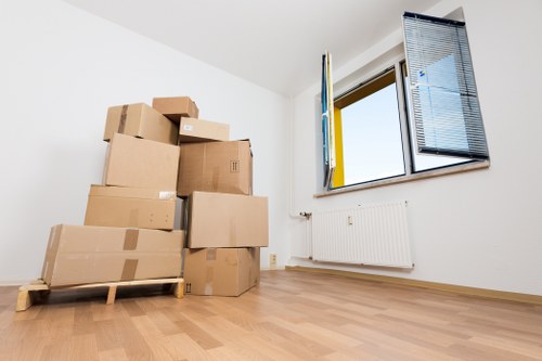 Removal van loading furniture outside a Tokyngton apartment building