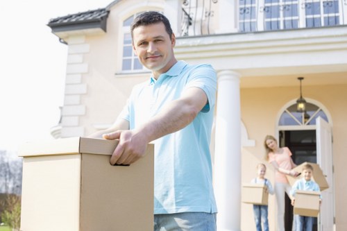 Removal van and movers during a local house relocation