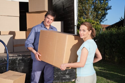 Professional movers handling furniture in Tokyngton
